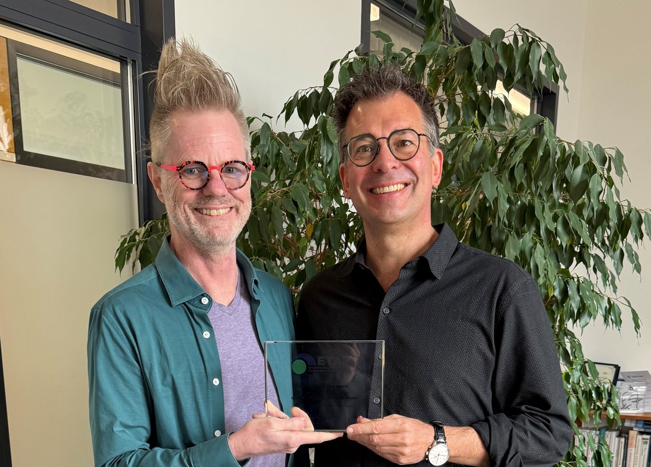 Rustan Leino and Peter Müller holding their Test of Time Award.